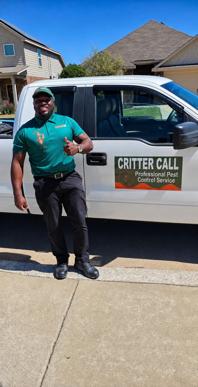 Critter Call technician beside a branded Critter Call service truck at a DFW home